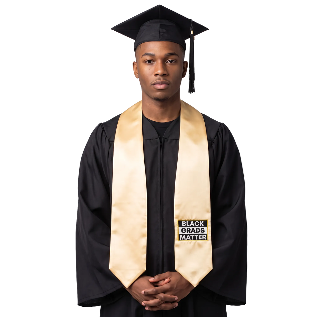 Antique gold graduation stole with “BLACK GRADS MATTER” lettering in a black and white rectangular design on one side and pointed ends.
