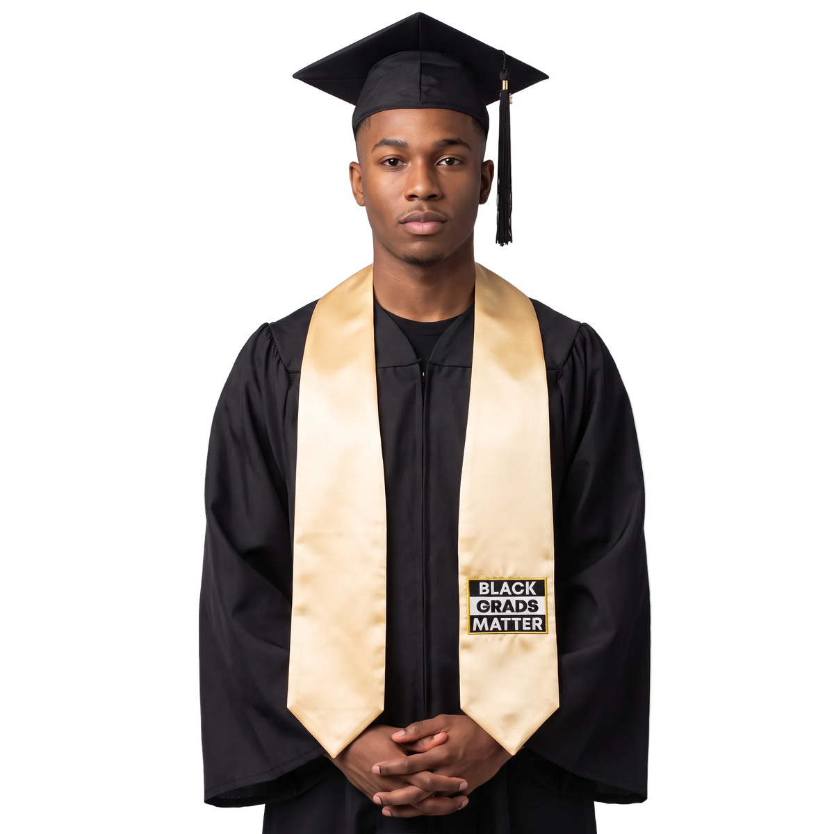 Antique gold graduation stole with “BLACK GRADS MATTER” lettering in a black and white rectangular design on one side and pointed ends.
