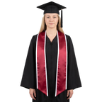 Graduate wearing a crimson graduation stole with white trim and slanted ends over a black gown, holding a black graduation cap.
