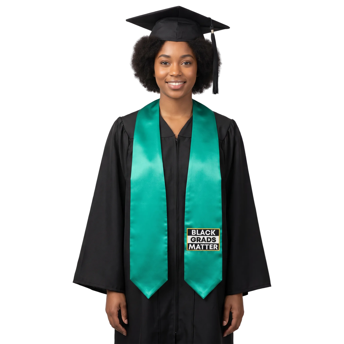 Emerald green graduation stole with “BLACK GRADS MATTER” lettering in a black and white rectangular design outlined in gold on one side and pointed ends.
