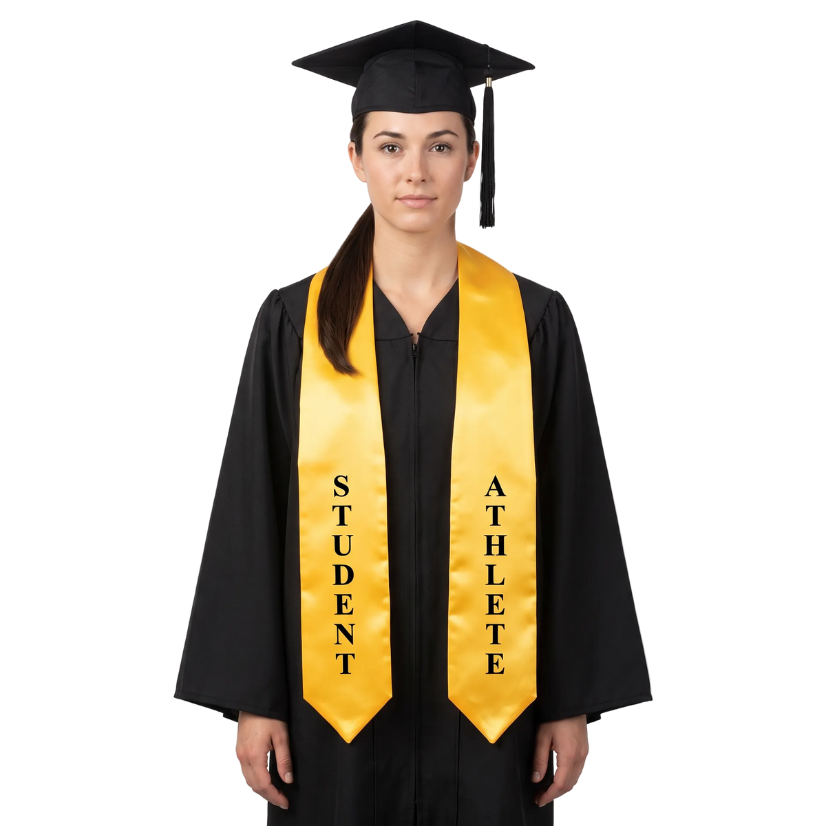 Graduate wearing a gold Student Athlete graduation stole with vertical black lettering on both sides and pointed ends over a black graduation gown.
