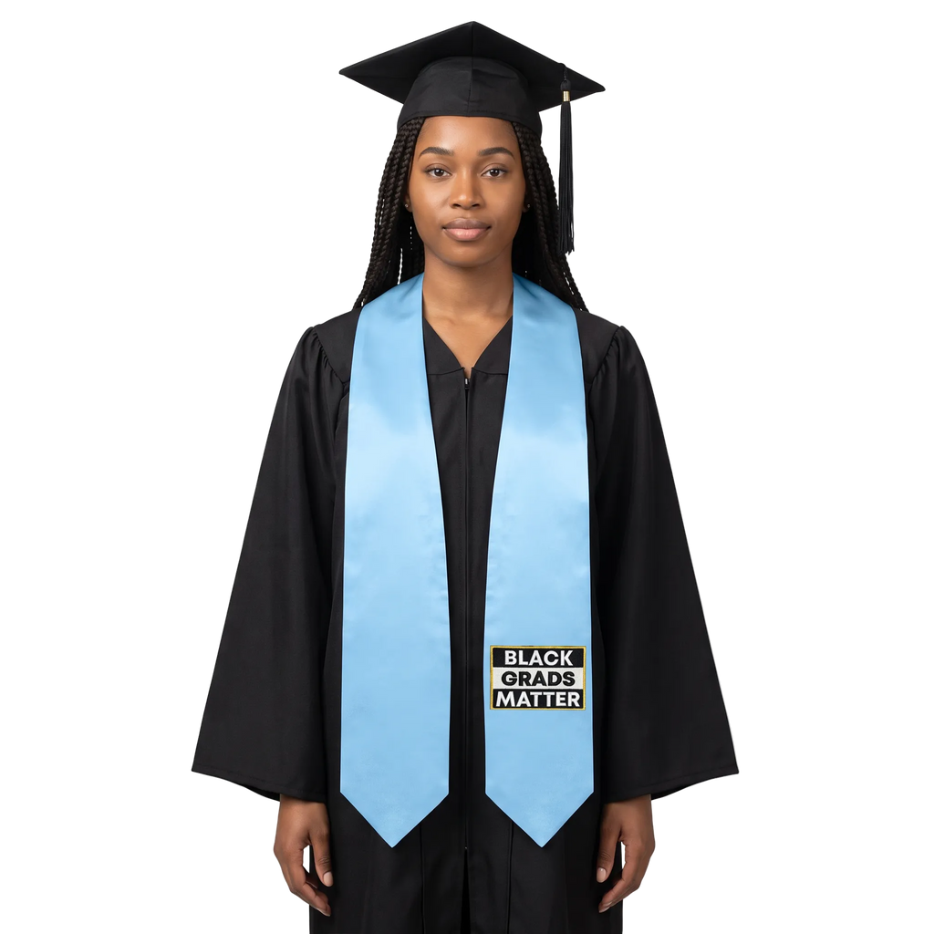 Light blue graduation stole with “BLACK GRADS MATTER” lettering in a black and white rectangular design outlined in gold on one side and pointed ends.
