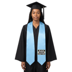Light blue graduation stole with “BLACK GRADS MATTER” lettering in a black and white rectangular design outlined in gold on one side and pointed ends.

