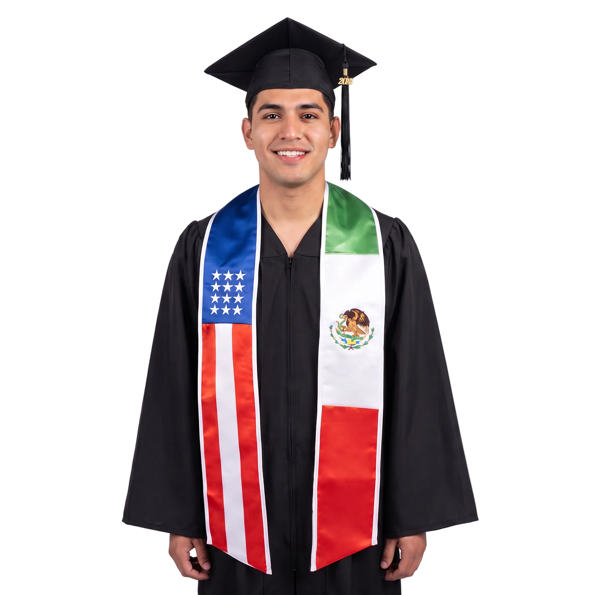 Graduate in a black cap and gown wearing a mixed USA and Mexico flag graduation stole, with American stars and stripes on one side and Mexican flag colors and coat of arms on the other.
