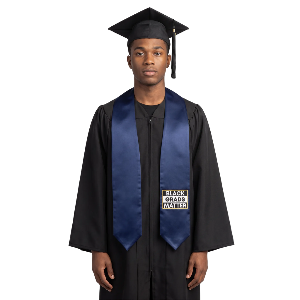 Navy blue graduation stole with “BLACK GRADS MATTER” lettering in a black and white rectangular design outlined in gold on one side and pointed ends.

