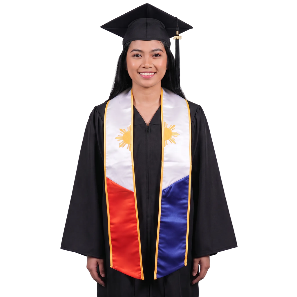 Graduate in a black cap and gown wearing a Philippines embroidered graduation stole with white upper panels, gold sun designs and trim, and red and blue lower panels.
