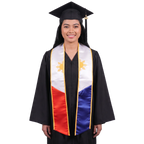 Graduate in a black cap and gown wearing a Philippines embroidered graduation stole with white upper panels, gold sun designs and trim, and red and blue lower panels.
