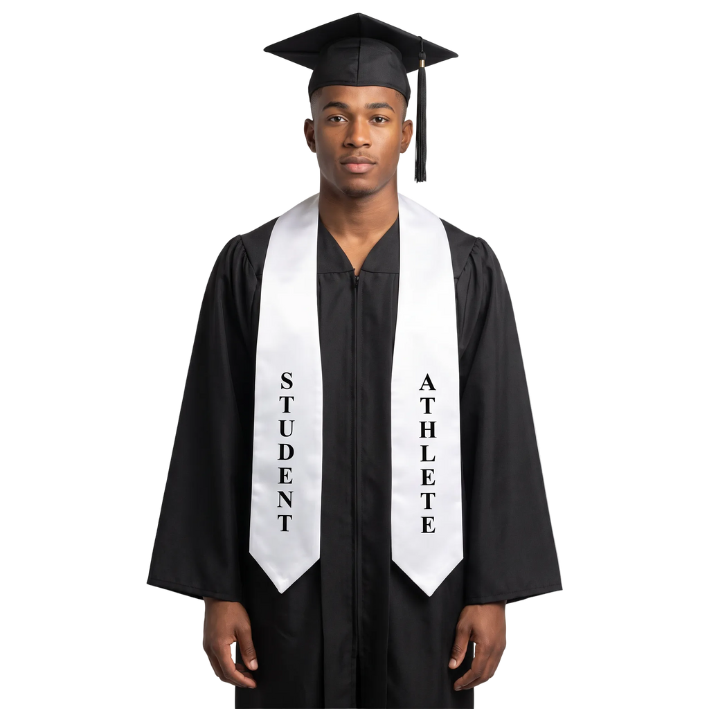 Graduate wearing a white Student Athlete graduation stole with vertical black “STUDENT” and “ATHLETE” lettering on opposite sides and pointed ends over a black graduation gown.
